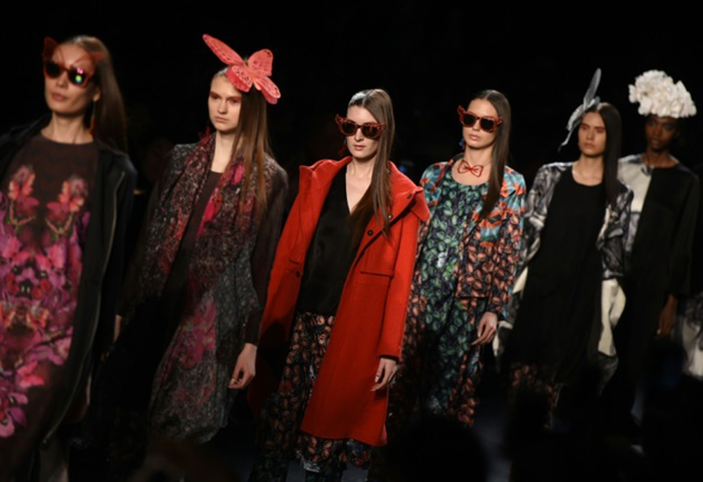 Models wear Polly Ho's AW16 designs at last year's NYFW (Photo by Timothy A Clary / AFP)